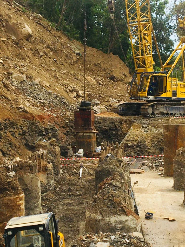 Excavator carrying out earthworks and regrading on site